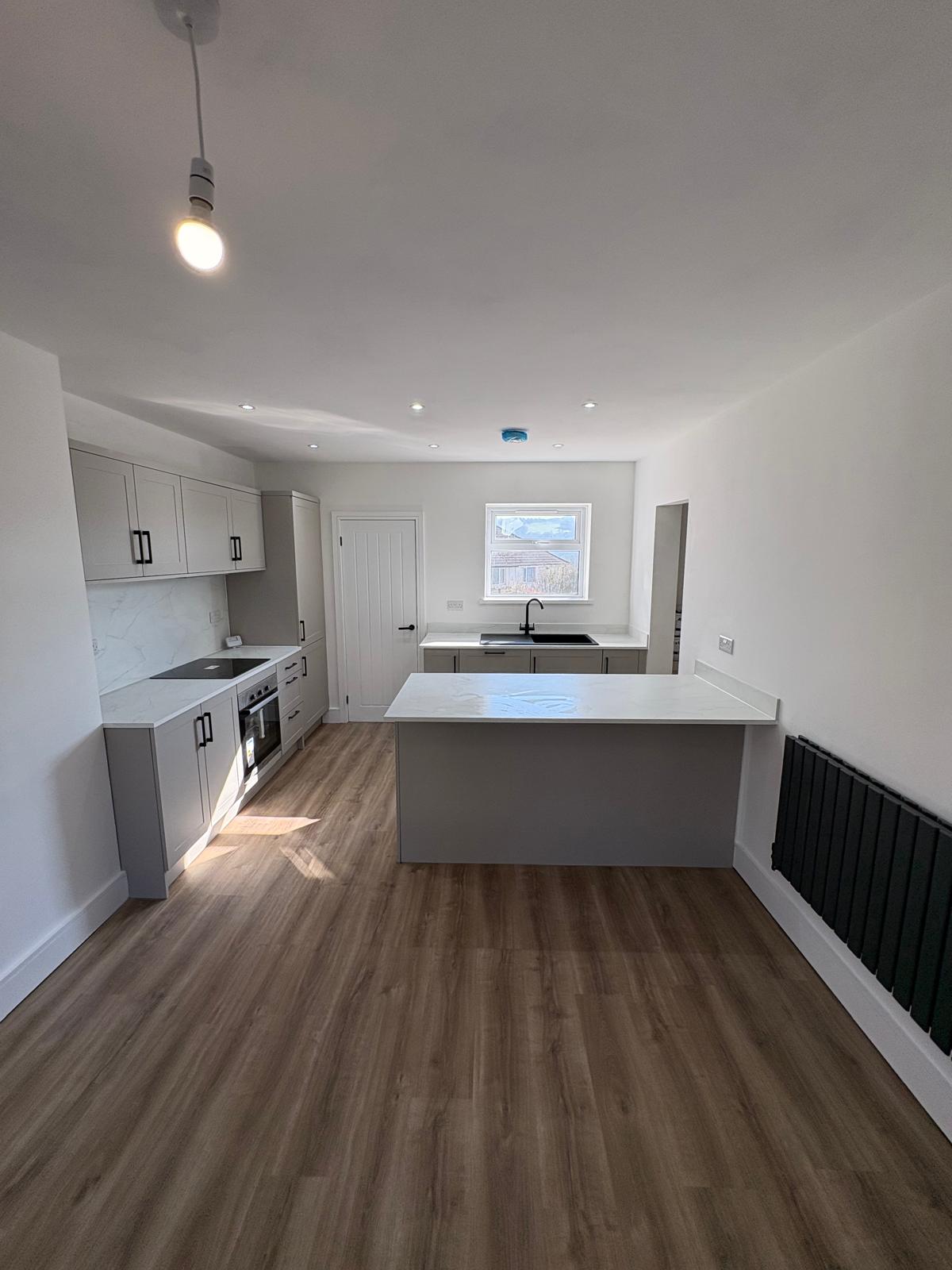 Finished open-plan kitchen with island
